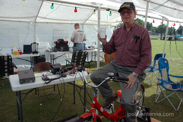 Dennis again showing off the bicycle generator for natural power QSOs.
